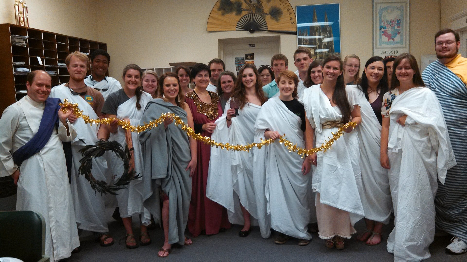a group of students wearing togas over their street clothes