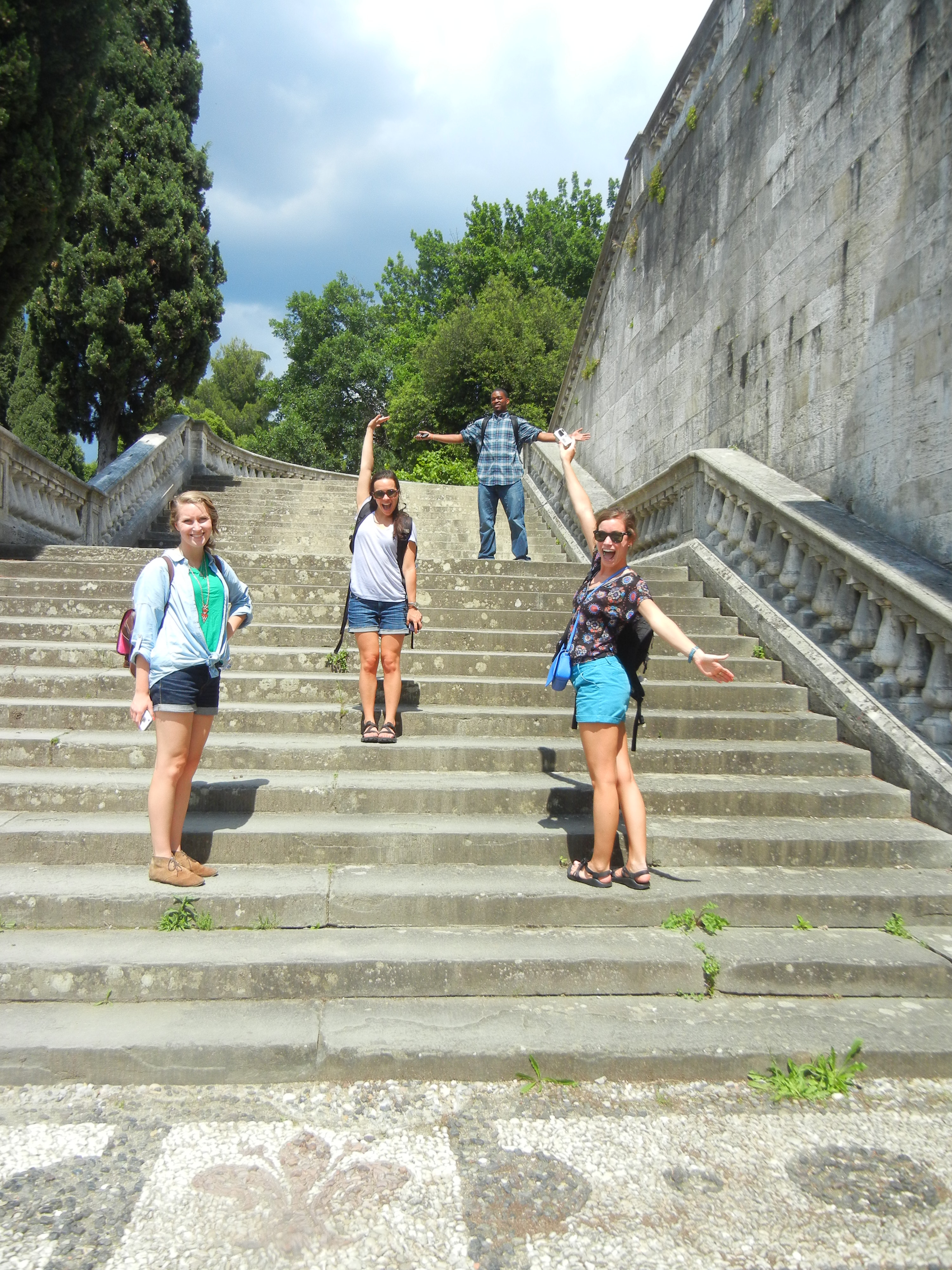 four UA students climbing steps in Florence, Italy