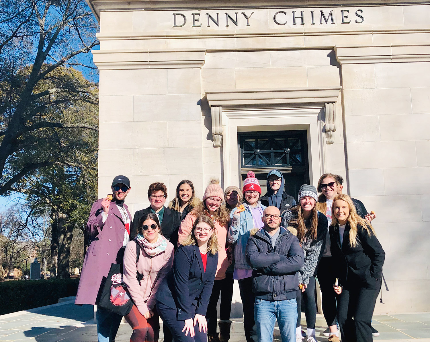 students posing in front of Denny Chimes